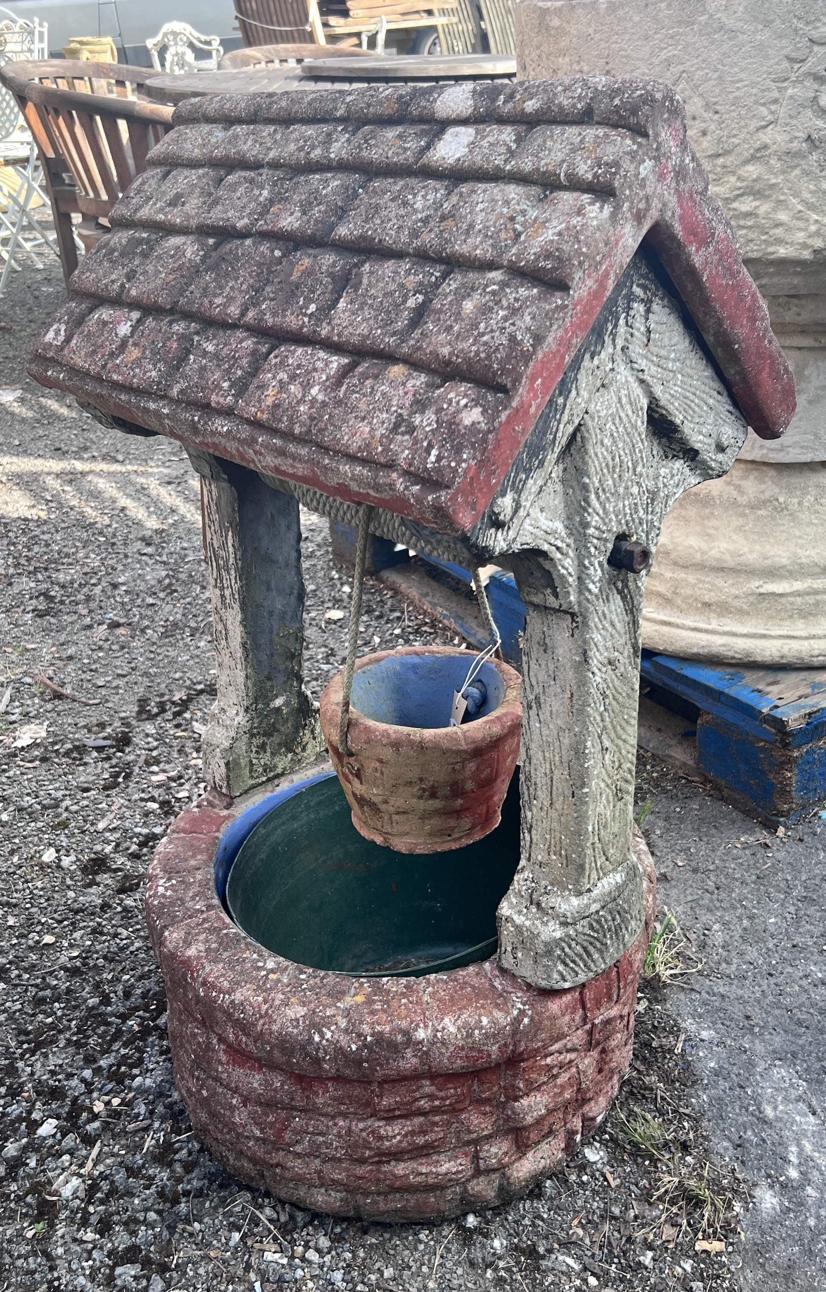 A large reconstituted stone ornamental wishing well garden planter, height 97cm